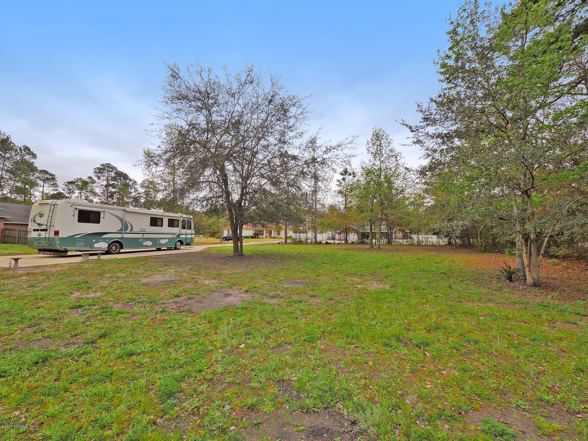 Lot Yellow Yellow Bluff Road Jacksonville, FL 32226 - Photo 6 of 16 a front view of a house with a yard