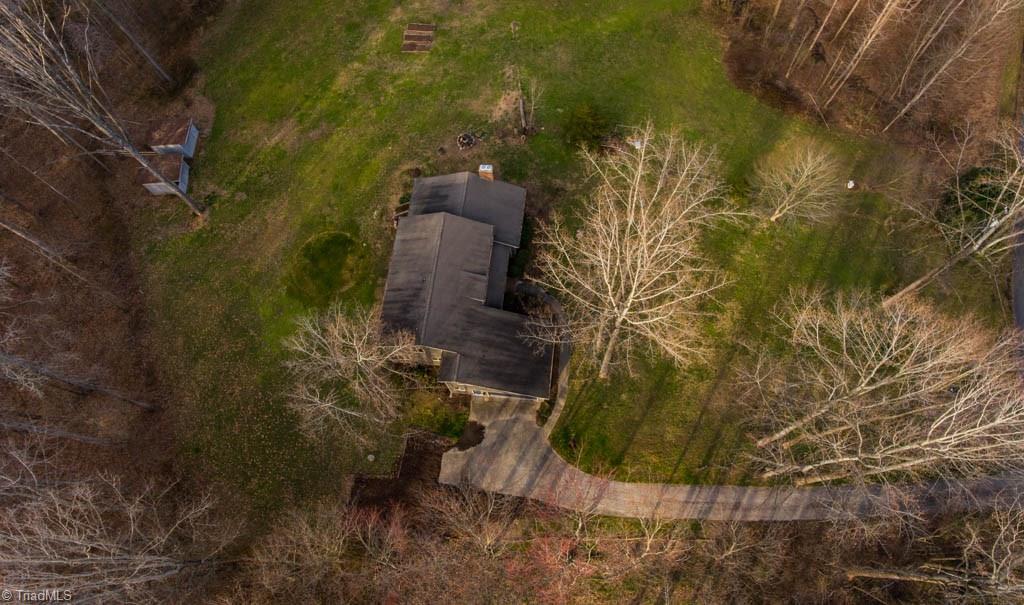 6520 Hollow River Drive Oak Ridge, NC 27310 - Photo 3 of 26 Area around the home has been cleared and is ideal for horses!