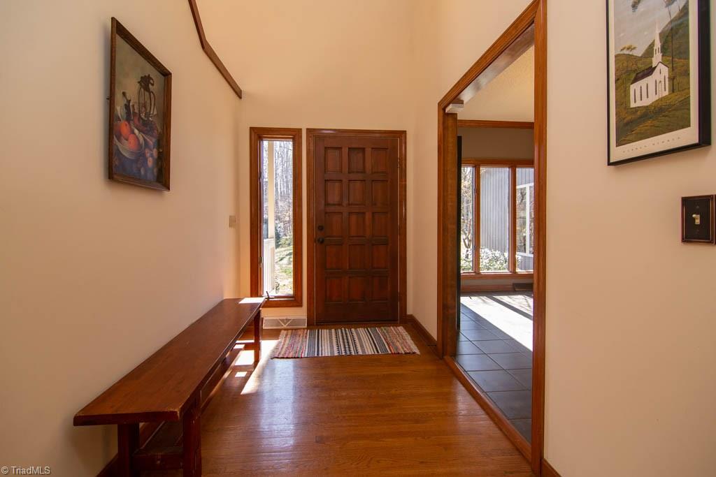 6520 Hollow River Drive Oak Ridge, NC 27310 - Photo 4 of 26 Foyer opens to the dining room.