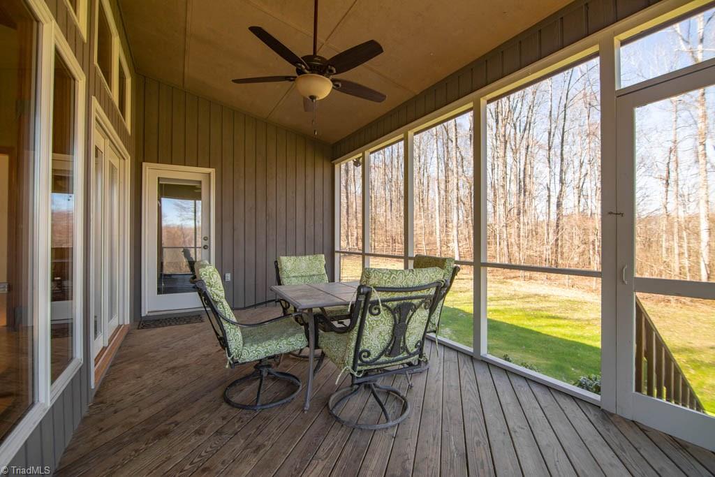 6520 Hollow River Drive Oak Ridge, NC 27310 - Photo 9 of 26 Fabulouse screen porch off great room with tranquil views.