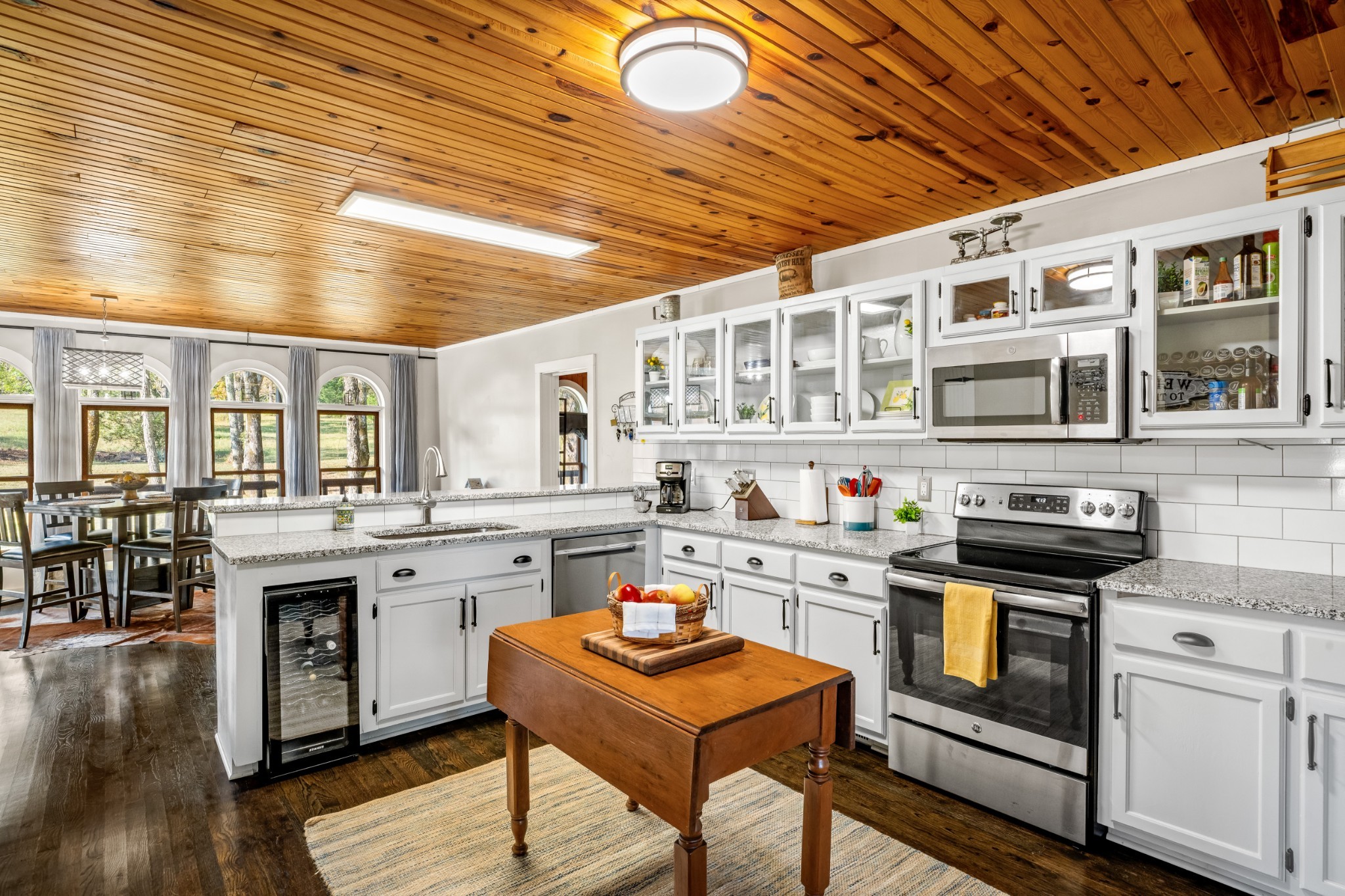 5285 Simmons Bluff Road Lebanon, TN 37090 - Photo 13 of 32 a kitchen with stainless steel appliances granite countertop a stove and cabinets