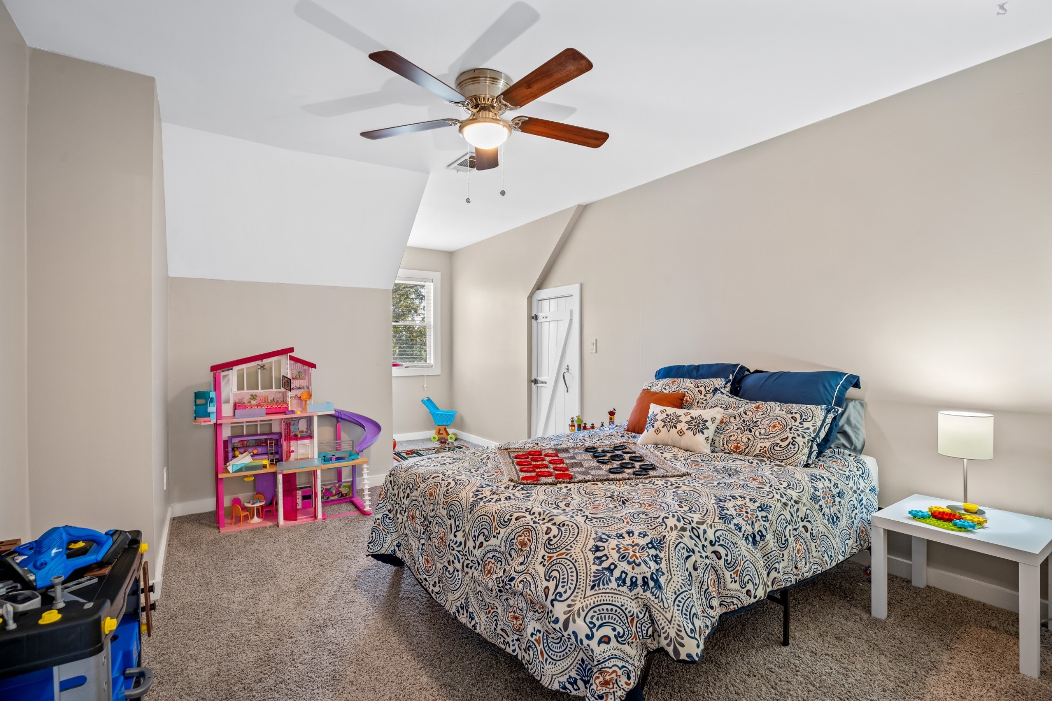 5285 Simmons Bluff Road Lebanon, TN 37090 - Photo 21 of 32 a bedroom with a bed and a chandelier