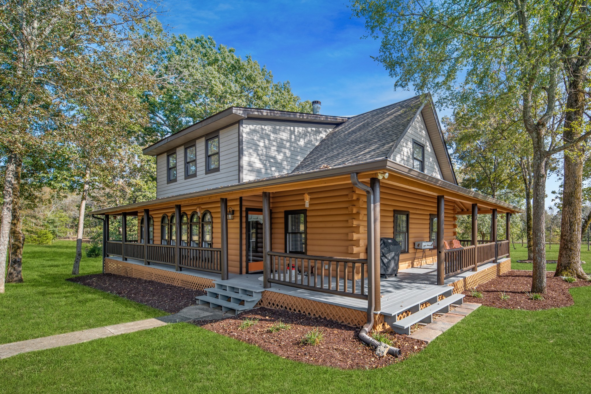 5285 Simmons Bluff Road Lebanon, TN 37090 - Photo 25 of 32 a view of a house with a yard and deck