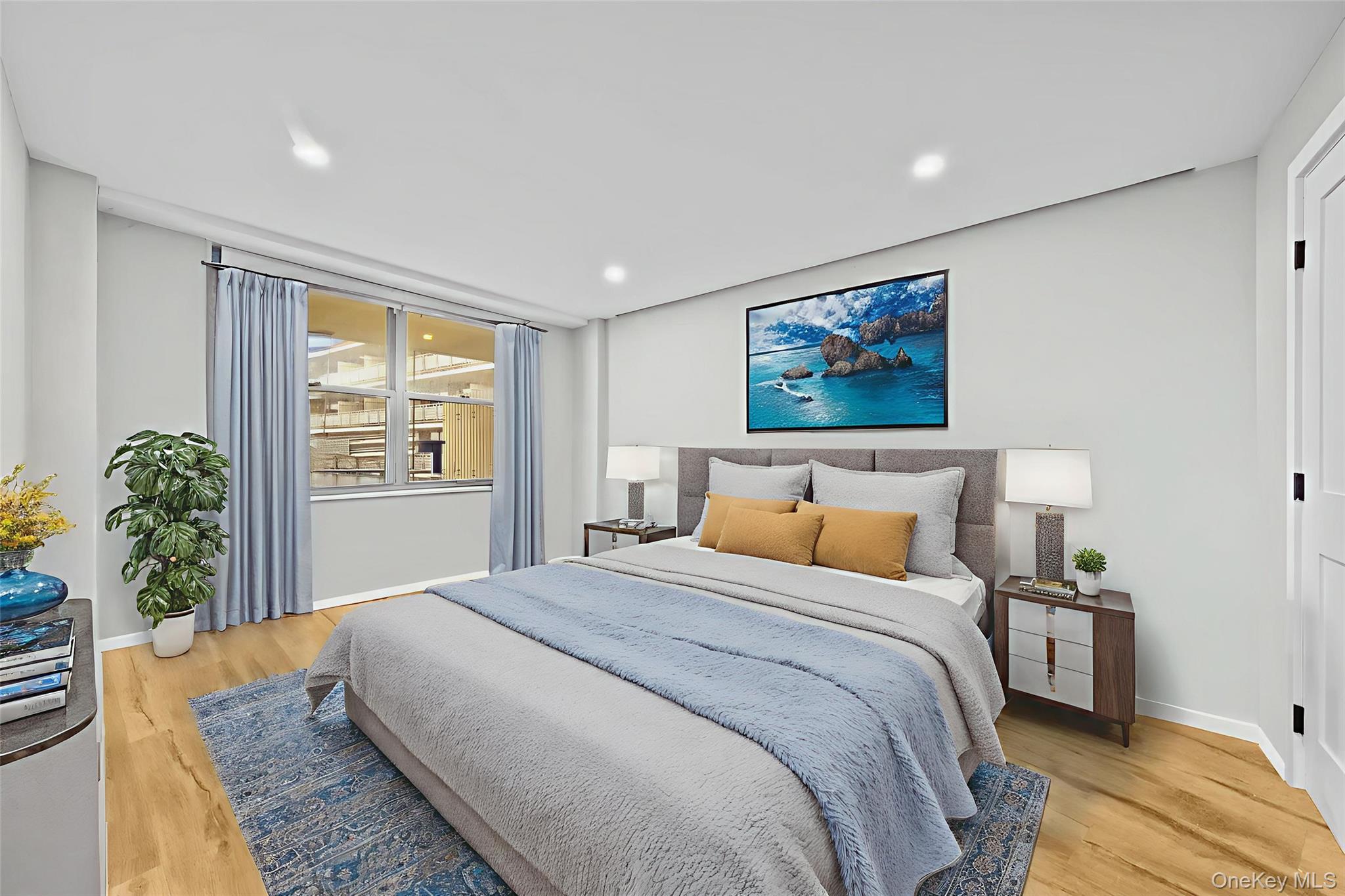 61-25 97th Street, Unit 12M Queens, NY 11374 - Photo 12 of 24 a bedroom with bed and a window