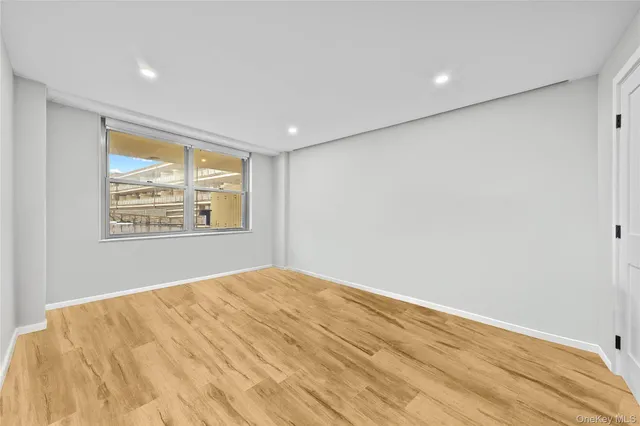 a bedroom with bed and a window