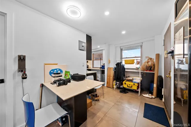 a living room with furniture and gym equipment