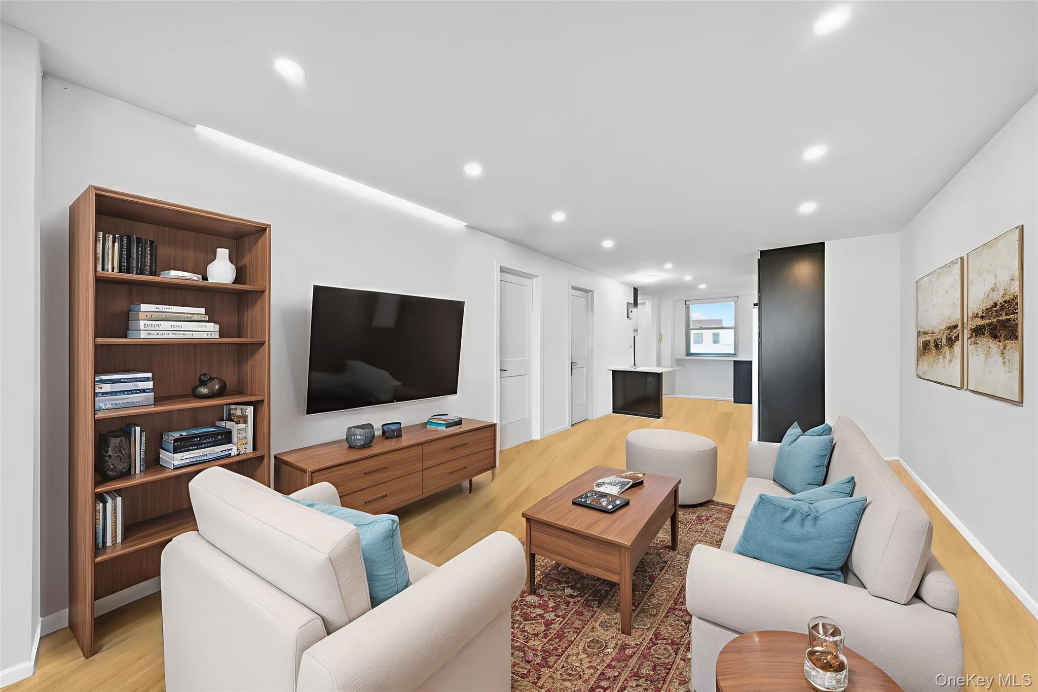 61-25 97th Street, Unit 12M Queens, NY 11374 - Photo 18 of 24 a living room with furniture and a flat screen tv