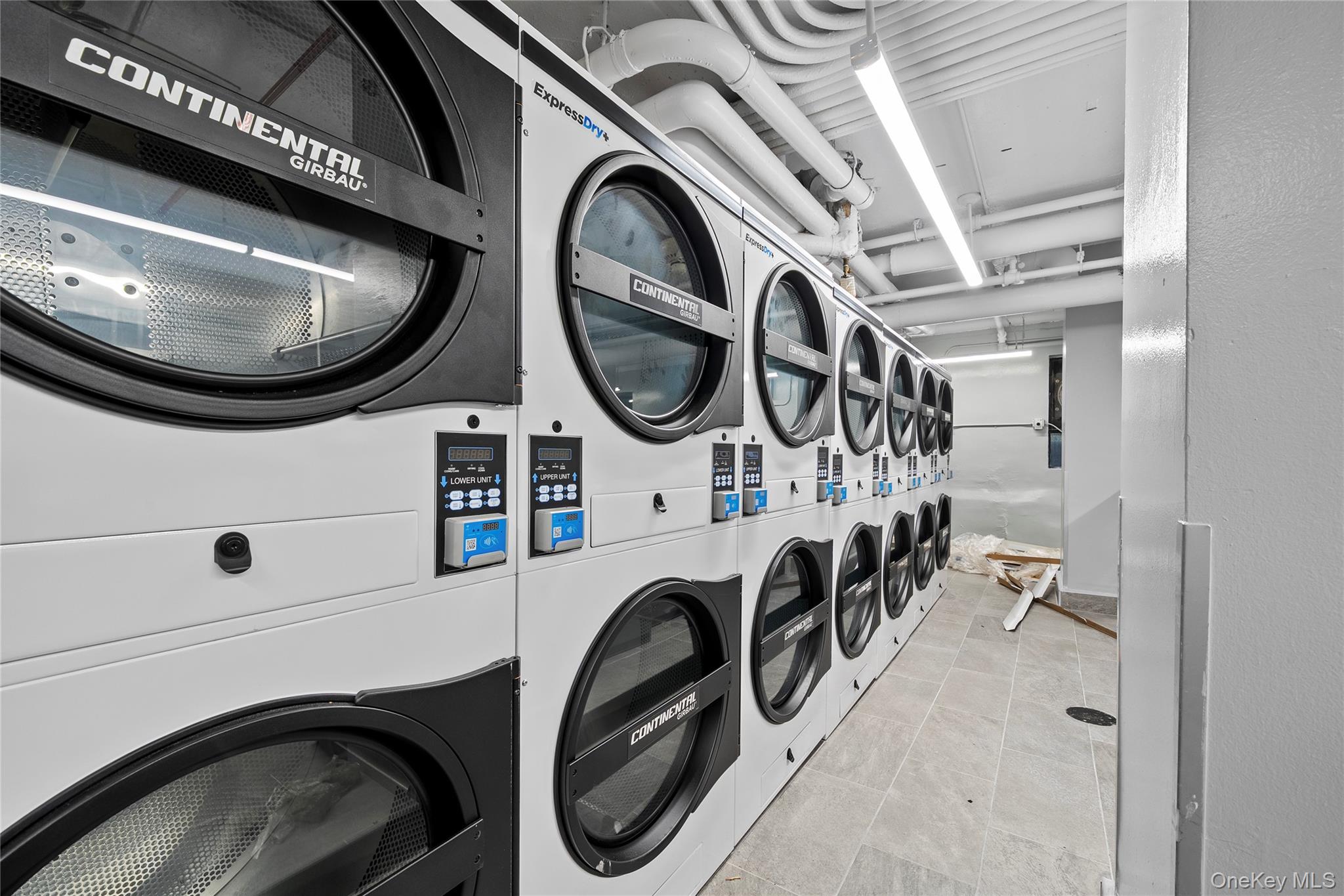 61-25 97th Street, Unit 12M Queens, NY 11374 - Photo 21 of 24 a utility room with dryer and washer
