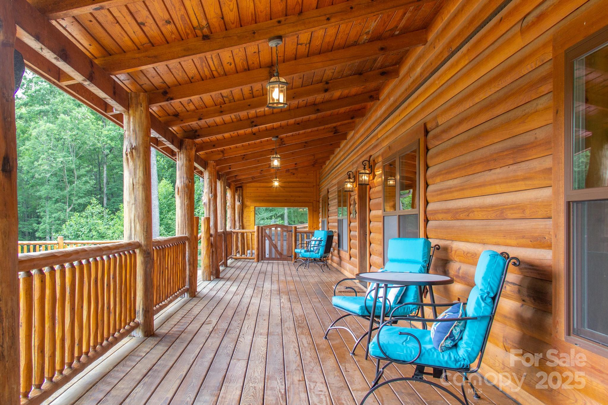 2811 Poplar Creek Road Green Mountain, NC 28740 - Photo 24 of 35 a view of a chairs and table in the balcony
