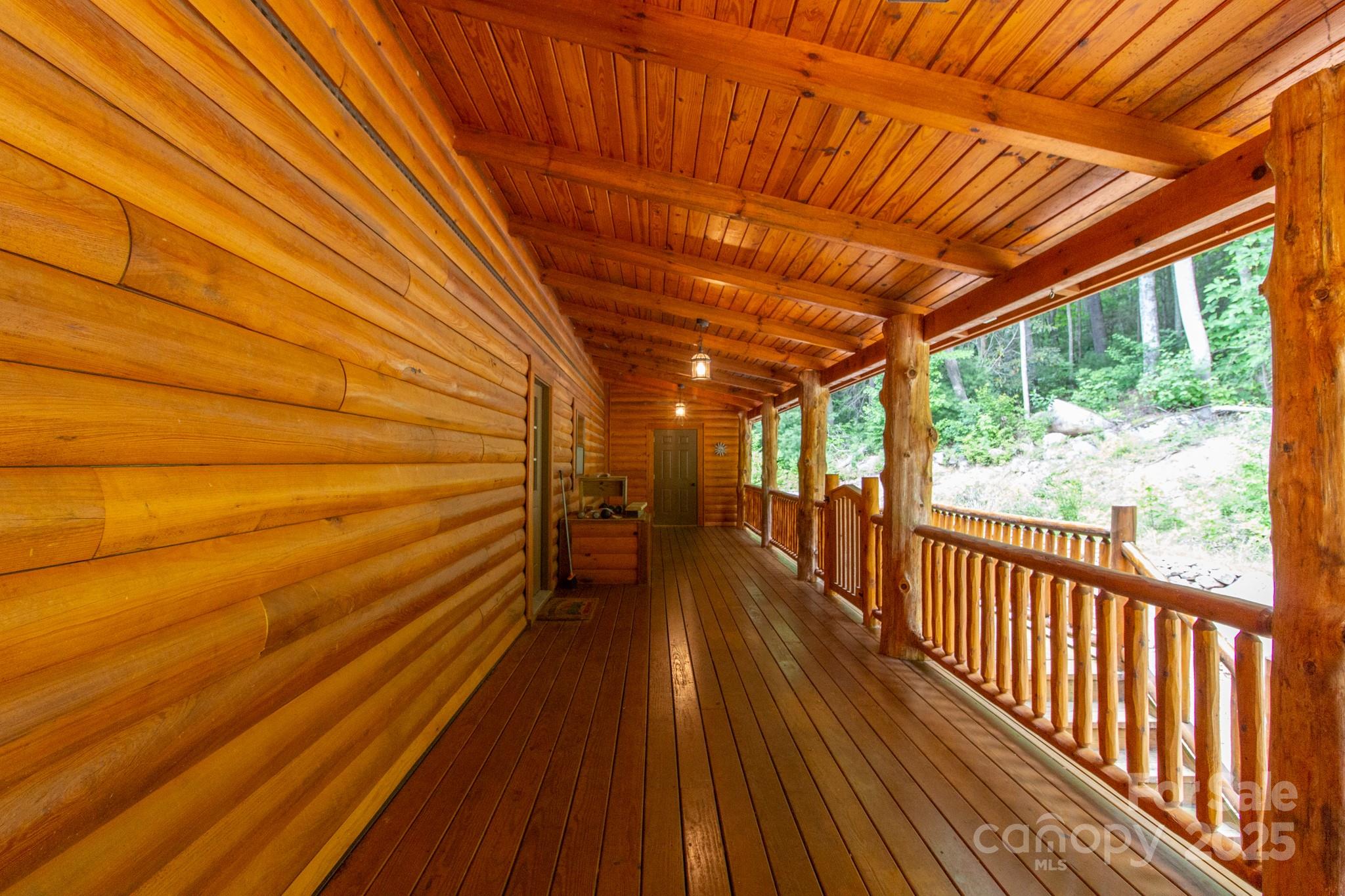 2811 Poplar Creek Road Green Mountain, NC 28740 - Photo 30 of 35 a view of a balcony with wooden floor