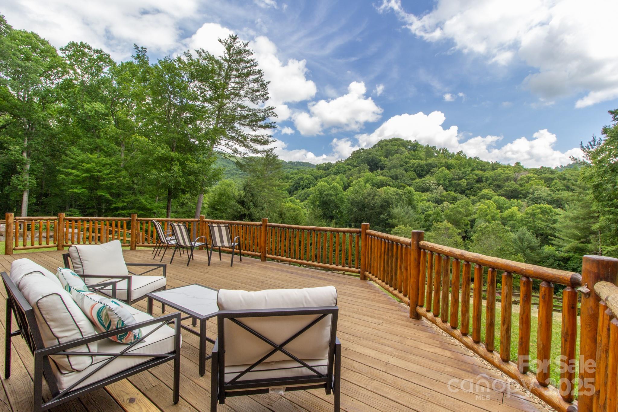 2811 Poplar Creek Road Green Mountain, NC 28740 - Photo 4 of 35 a balcony with wooden floor and fence