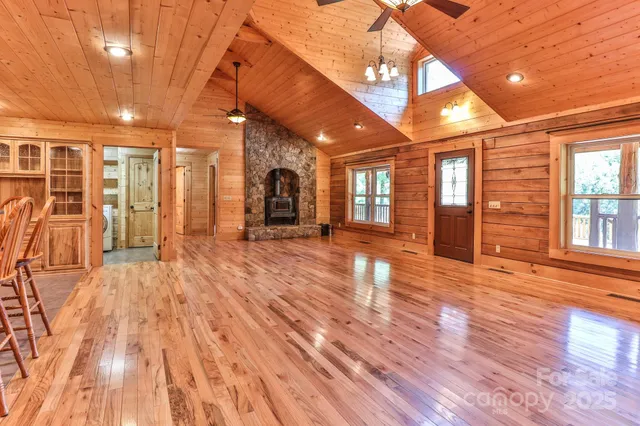 a view of a room with wooden floors