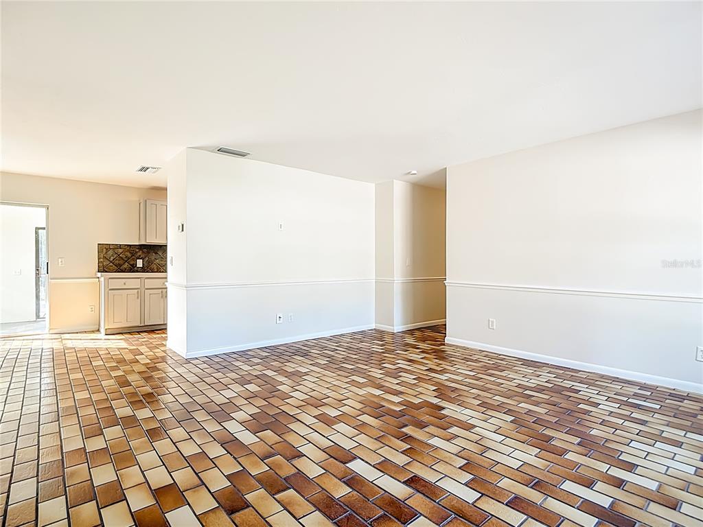 7286 Jonas Road Fort Myers, FL 33967 - Photo 11 of 81 a view of empty room with wooden floor