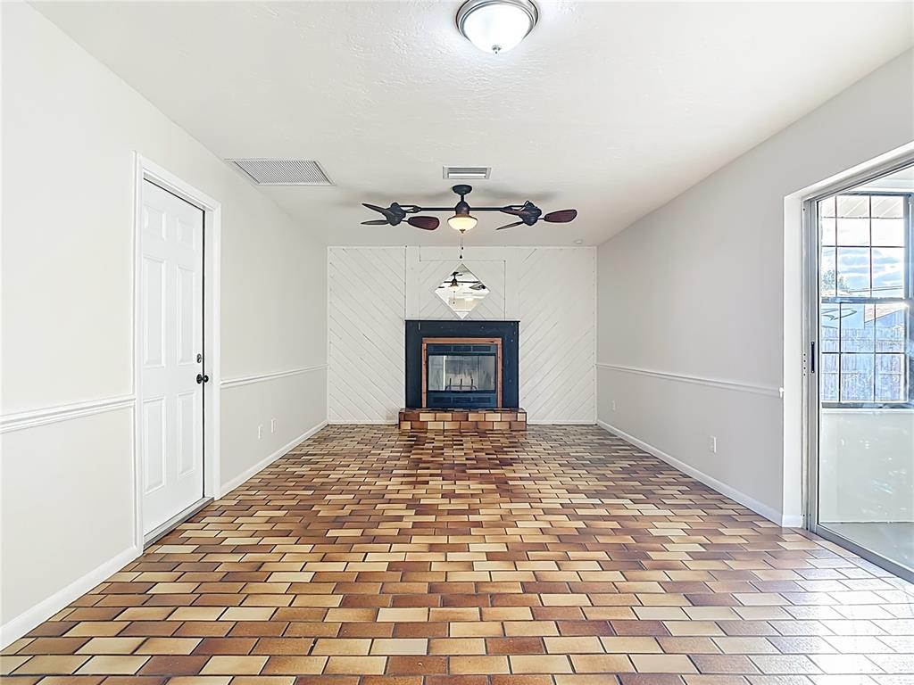 7286 Jonas Road Fort Myers, FL 33967 - Photo 14 of 81 a view of a hallway with a chandelier