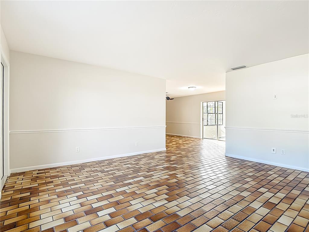 7286 Jonas Road Fort Myers, FL 33967 - Photo 15 of 81 a view of empty room with wooden floor