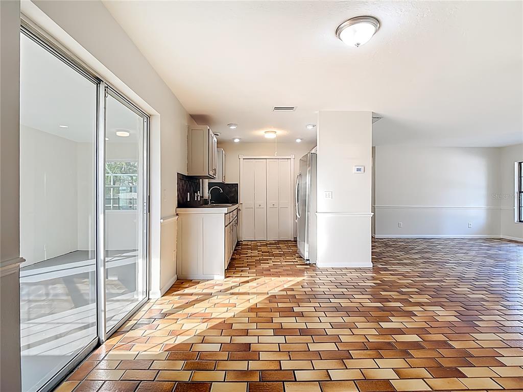 7286 Jonas Road Fort Myers, FL 33967 - Photo 17 of 81 a view of a refrigerator in kitchen and wooden floor