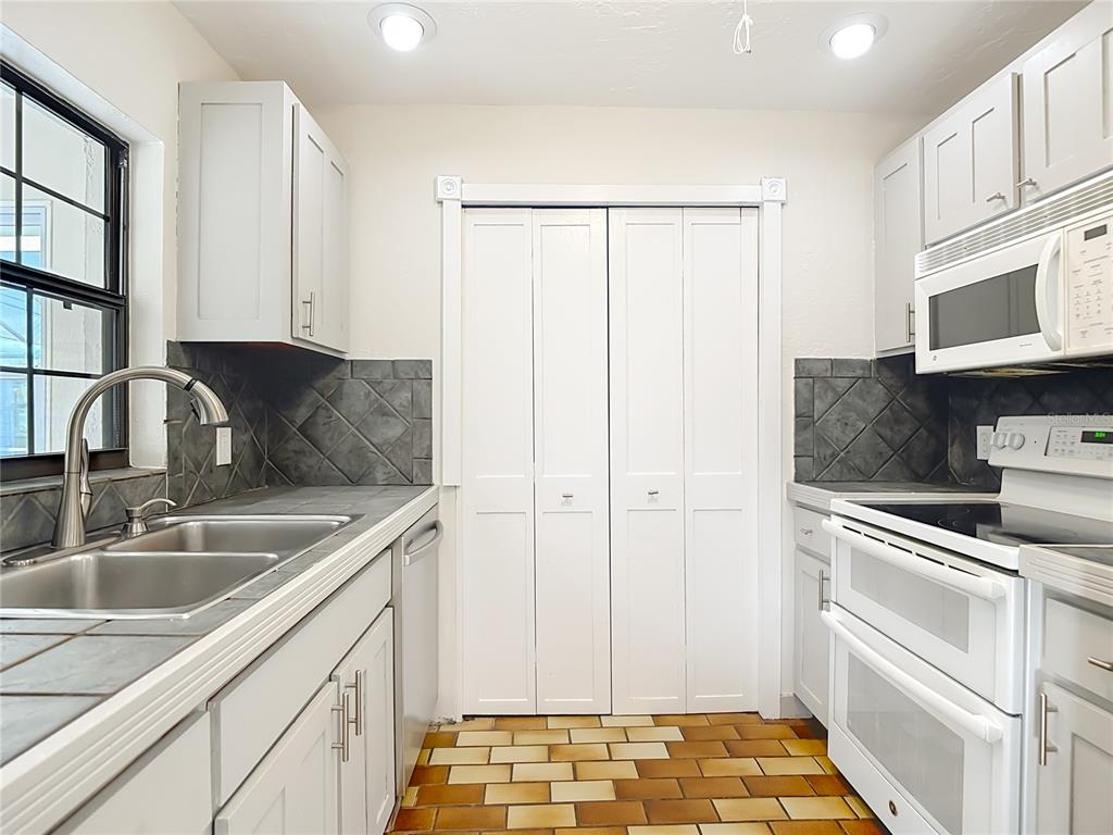 7286 Jonas Road Fort Myers, FL 33967 - Photo 20 of 81 a kitchen with stainless steel appliances granite countertop a sink and a microwave