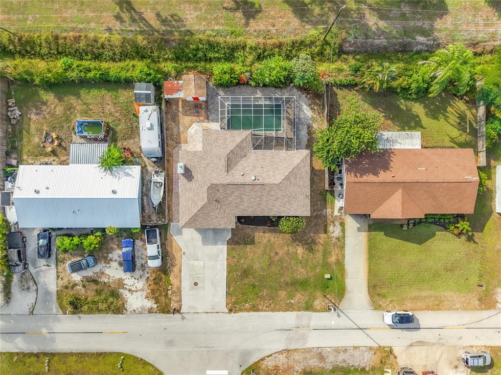 7286 Jonas Road Fort Myers, FL 33967 - Photo 2 of 81 an aerial view of residential houses with outdoor space and lake view