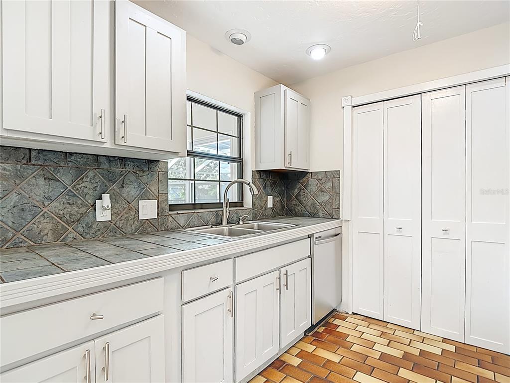 7286 Jonas Road Fort Myers, FL 33967 - Photo 21 of 81 a kitchen with granite countertop white cabinets and sink
