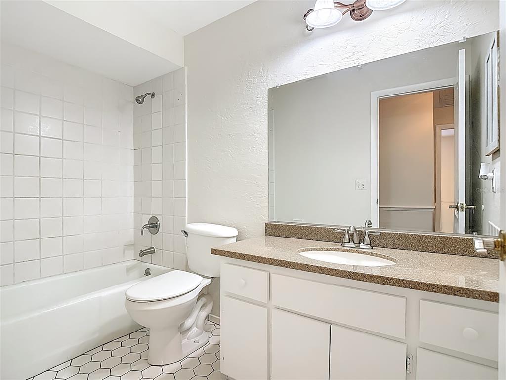 7286 Jonas Road Fort Myers, FL 33967 - Photo 35 of 81 a bathroom with a double vanity sink toilet and shower