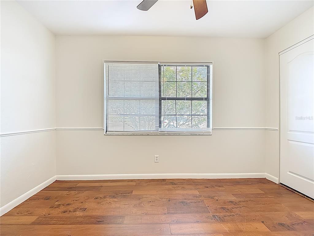 7286 Jonas Road Fort Myers, FL 33967 - Photo 39 of 81 an empty room with wooden floor and windows