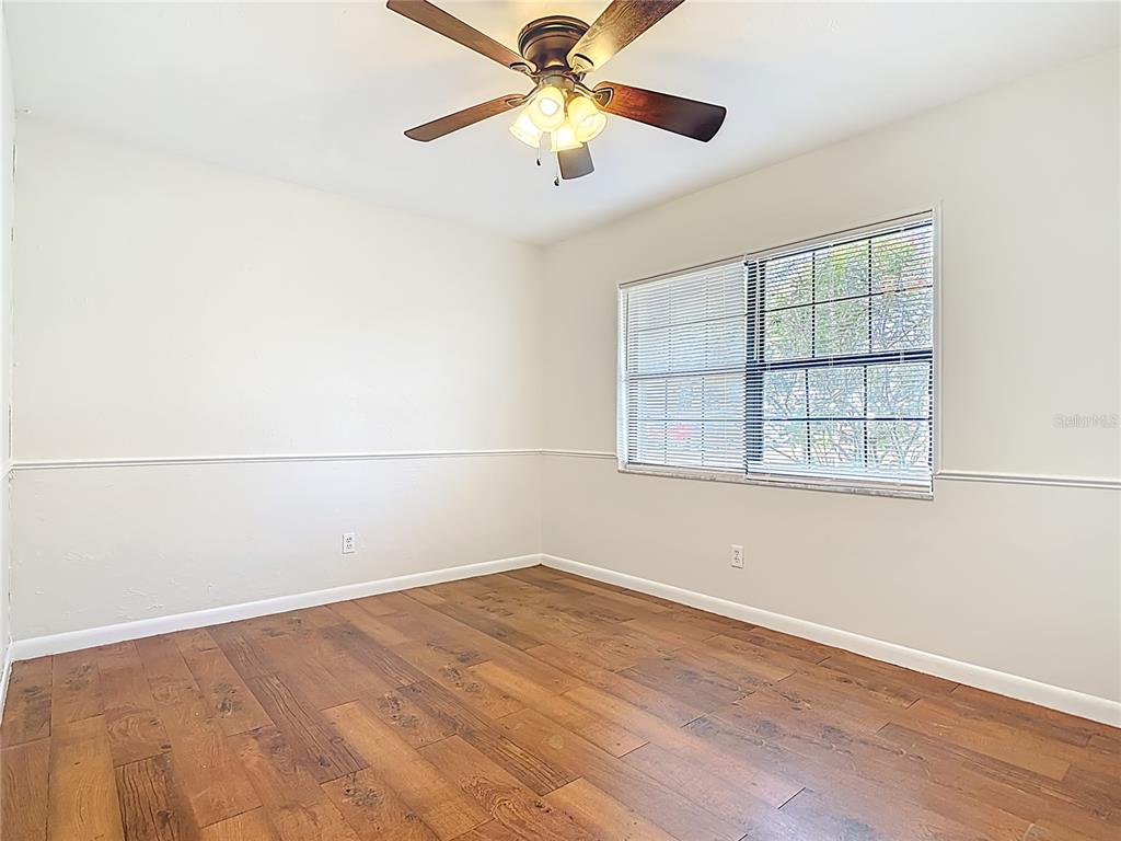 7286 Jonas Road Fort Myers, FL 33967 - Photo 40 of 81 an empty room with a window and a ceiling fan