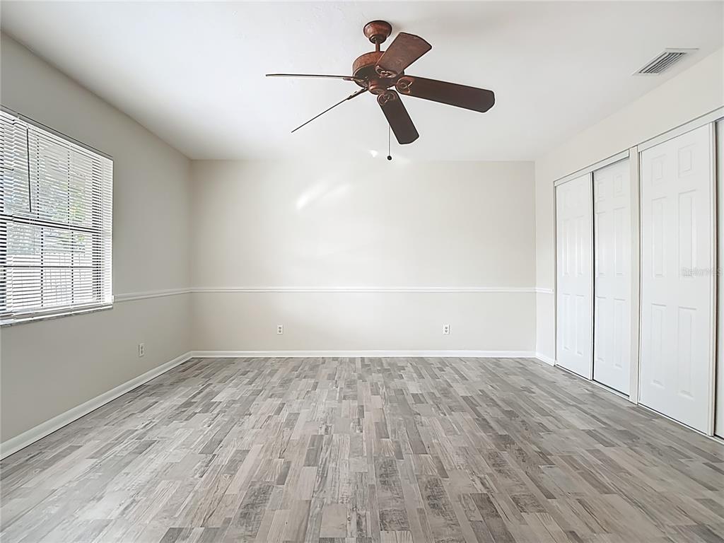 7286 Jonas Road Fort Myers, FL 33967 - Photo 43 of 81 wooden floor in an empty room with a window