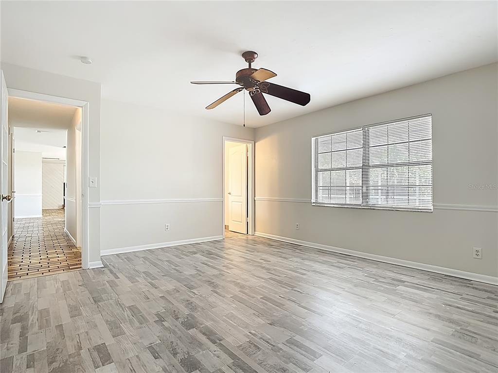 7286 Jonas Road Fort Myers, FL 33967 - Photo 45 of 81 a view of empty room with wooden floor and fan