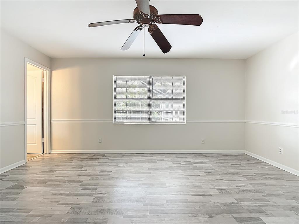7286 Jonas Road Fort Myers, FL 33967 - Photo 46 of 81 wooden floor in an empty room with a window
