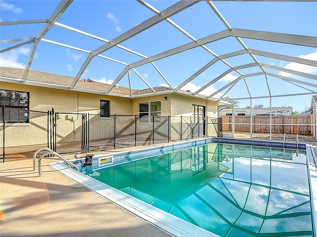 7286 Jonas Road Fort Myers, FL 33967 - Photo 5 of 81 a view of a swimming pool with a patio