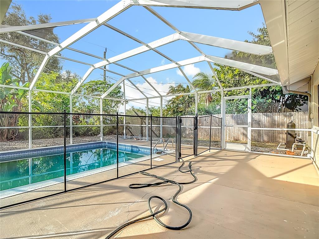 7286 Jonas Road Fort Myers, FL 33967 - Photo 54 of 81 a view of a room with wooden floor and windows