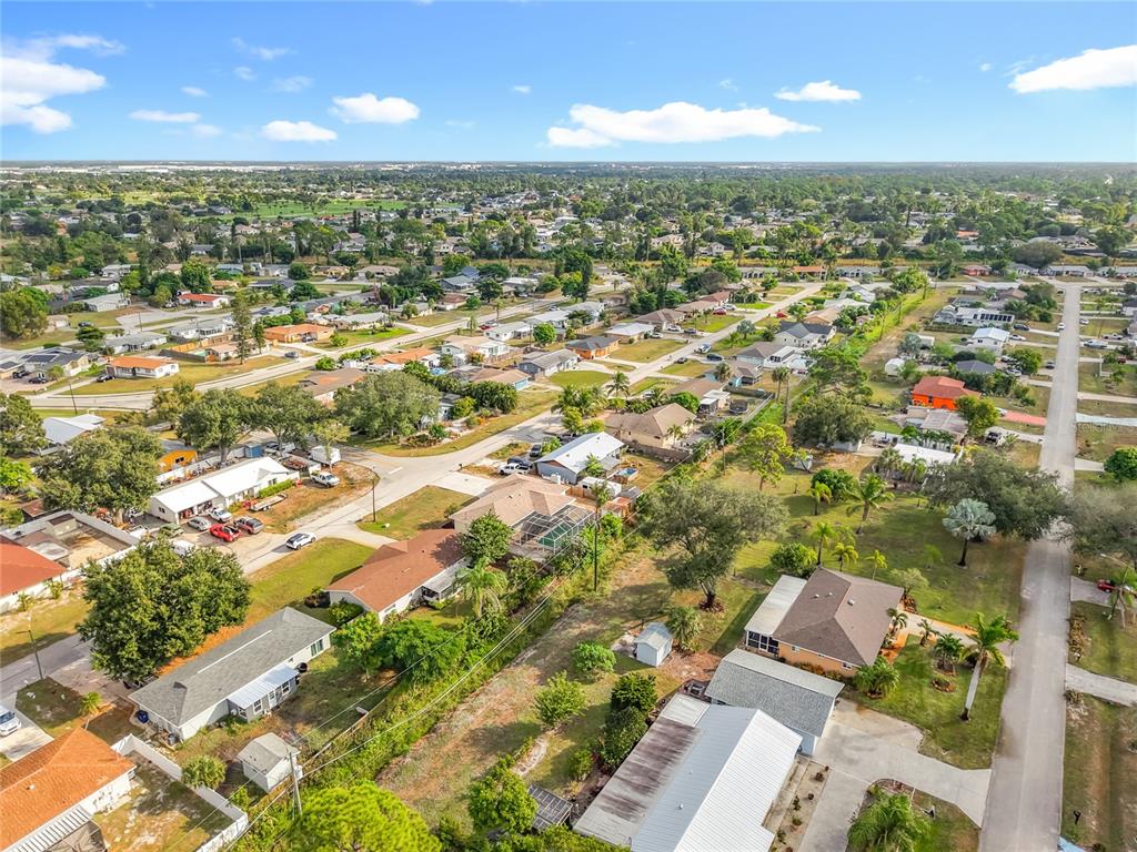 7286 Jonas Road Fort Myers, FL 33967 - Photo 68 of 81 an aerial view of residential houses with outdoor space and trees