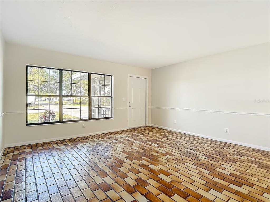 7286 Jonas Road Fort Myers, FL 33967 - Photo 10 of 81 a view of an empty room with a window
