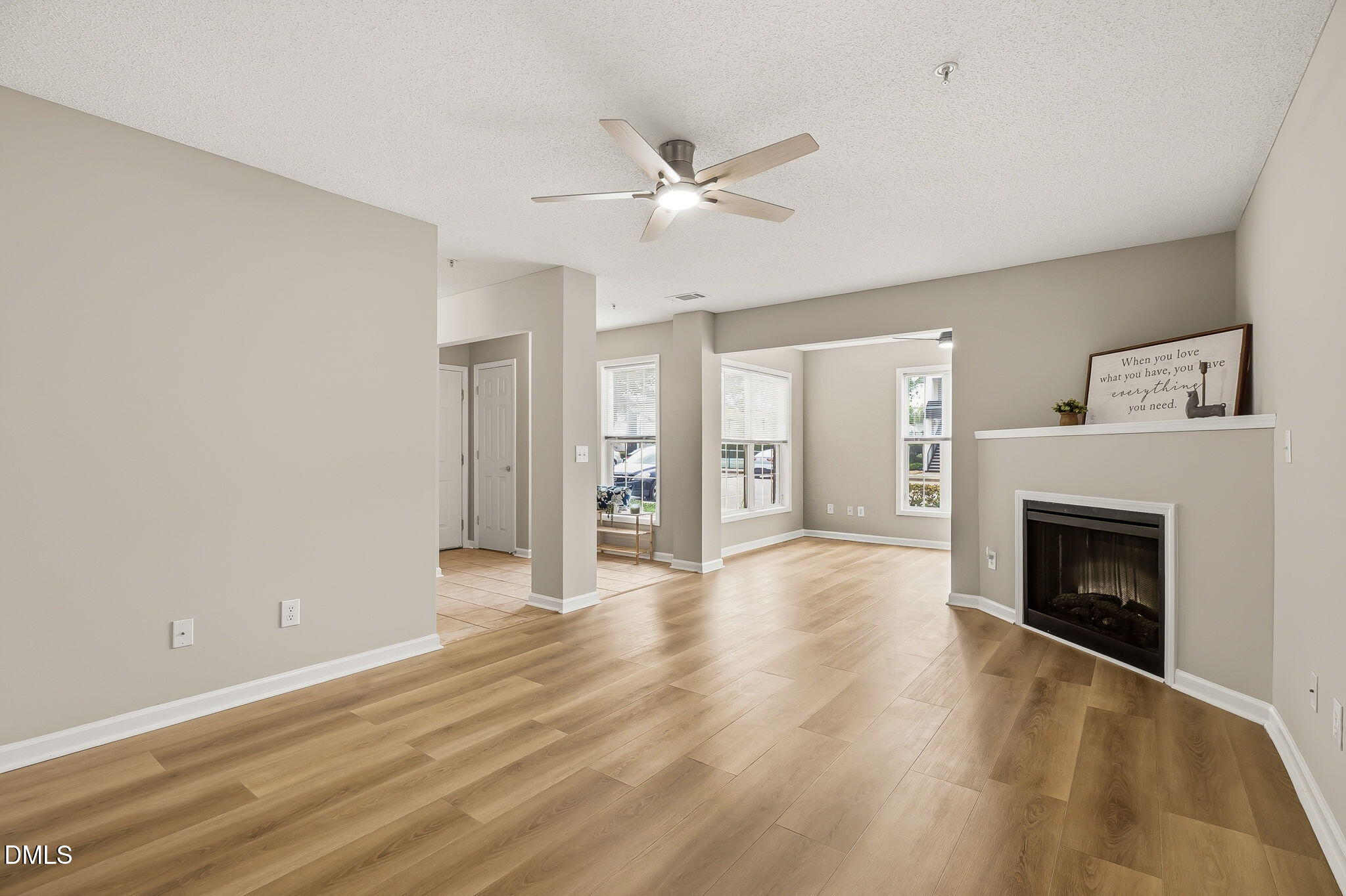 2501 Huntscroft Lane, Unit 100 Raleigh, NC 27617 - Photo 17 of 31 a view of an empty room with window and fire place