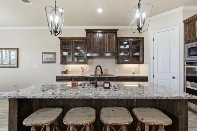 a view of kitchen island granite countertop living room