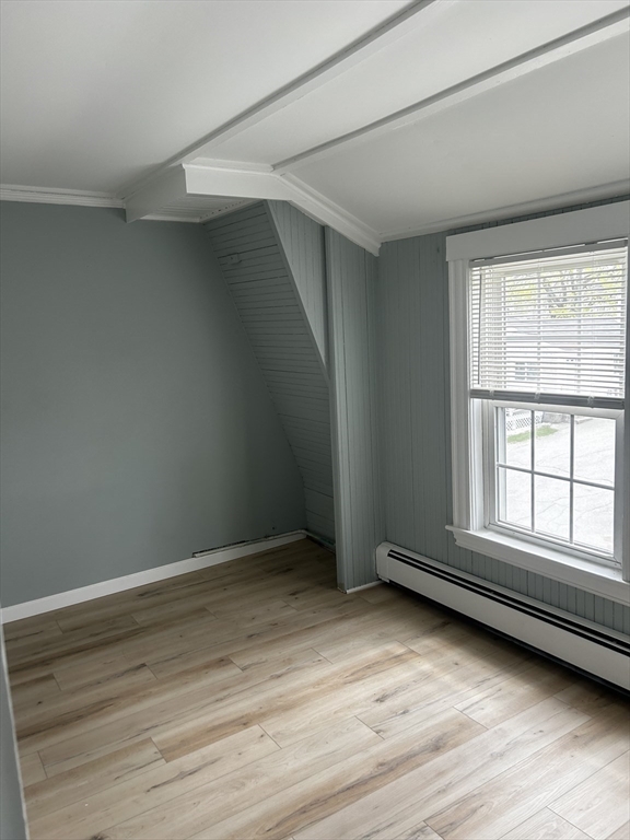 8 Beaver Dam Road, Unit B Scituate, MA 02066 - Photo 10 of 14 an empty room with wooden floor and windows