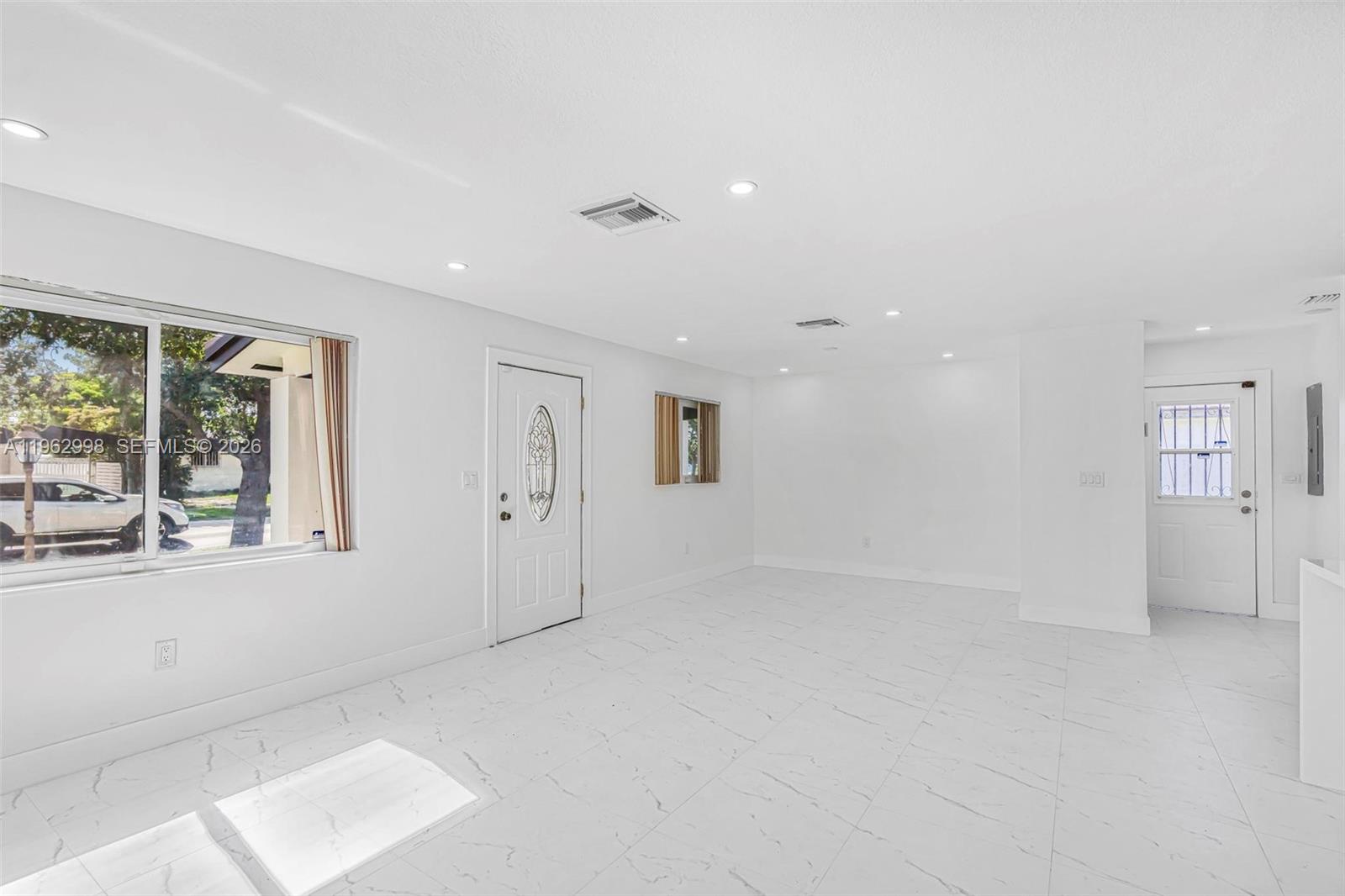 2901 Southwest 92nd Avenue Miami, FL 33165 - Photo 5 of 38 an empty room with windows