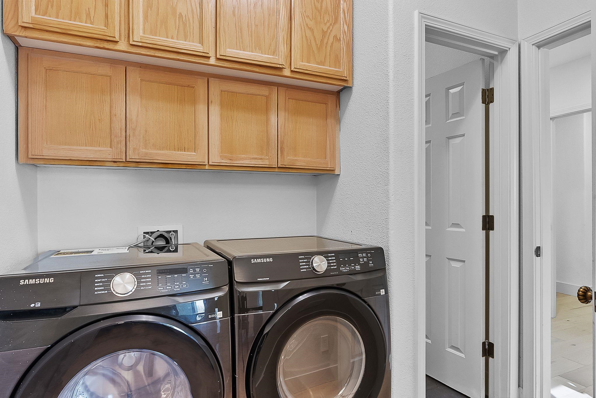 536 Birchwood Road Brentwood, CA 94513 - Photo 11 of 45 Laundry room featuring washer and clothes dryer and cabinet space