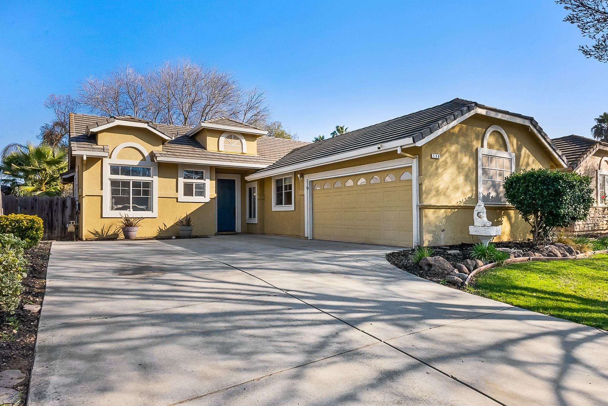 536 Birchwood Road Brentwood, CA 94513 - Photo 2 of 45 View of front of home with stucco siding, a garage, driveway, and a tiled roof