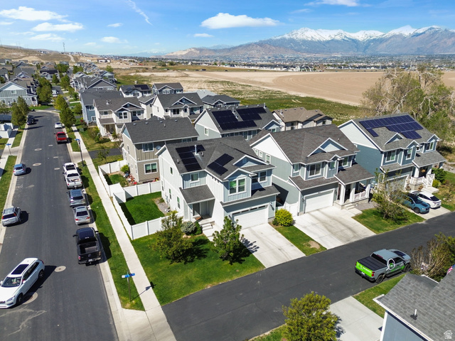5155 East Rio Grande Way Eagle Mountain, UT 84005 - Photo 35 of 40 Aerial view of residential area with a mountain backdrop