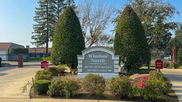 a view of a house with a yard and plants