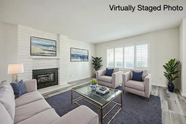 a view of a room with wooden floor and window