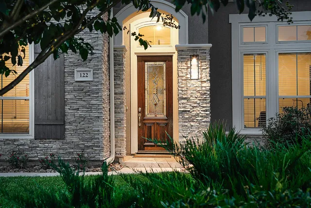 a front view of a house with a yard