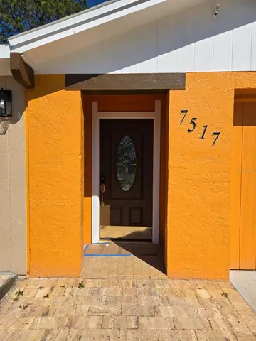 a front view of a house with a wooden door