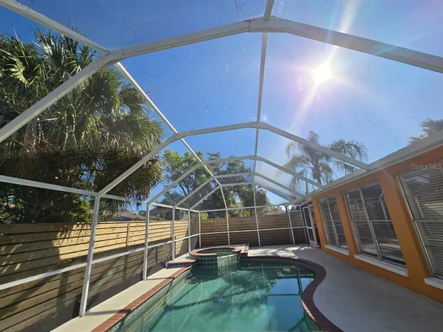 a view of a backyard with sitting area