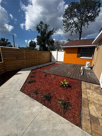 a sitting area with swimming pool in front of it