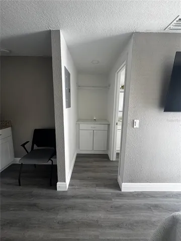 a bathroom with a granite countertop sink a toilet and shower