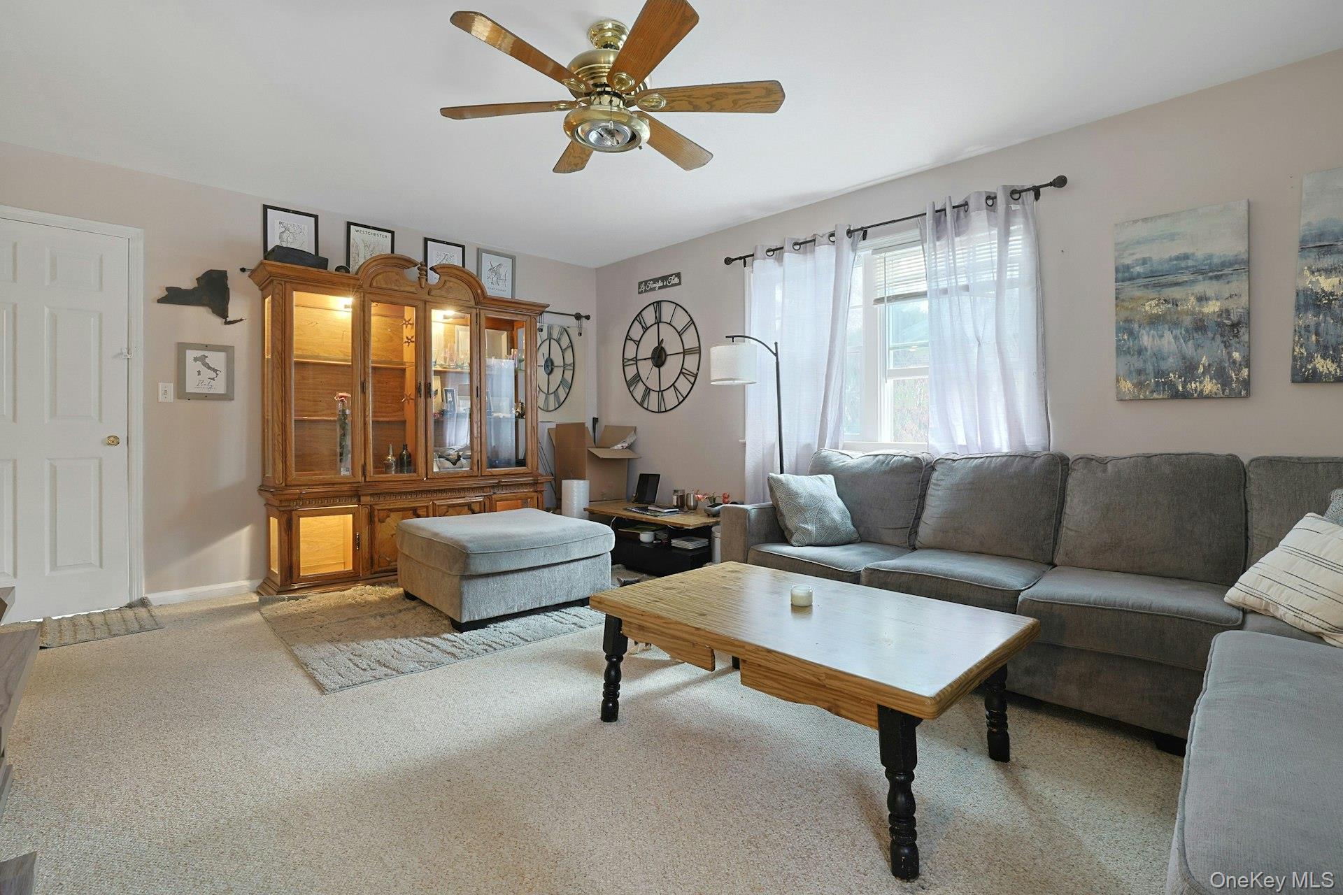 31 West Linwood Street Valhalla, NY 10595 - Photo 25 of 34 a living room with furniture and a chandelier
