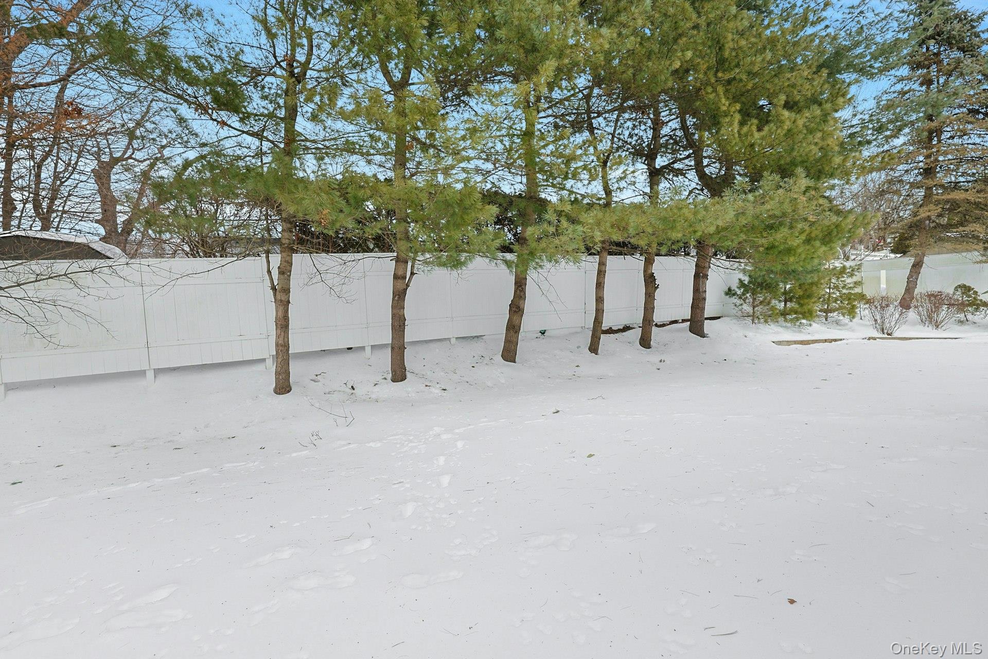 31 West Linwood Street Valhalla, NY 10595 - Photo 29 of 34 a view of backyard with a table and chairs