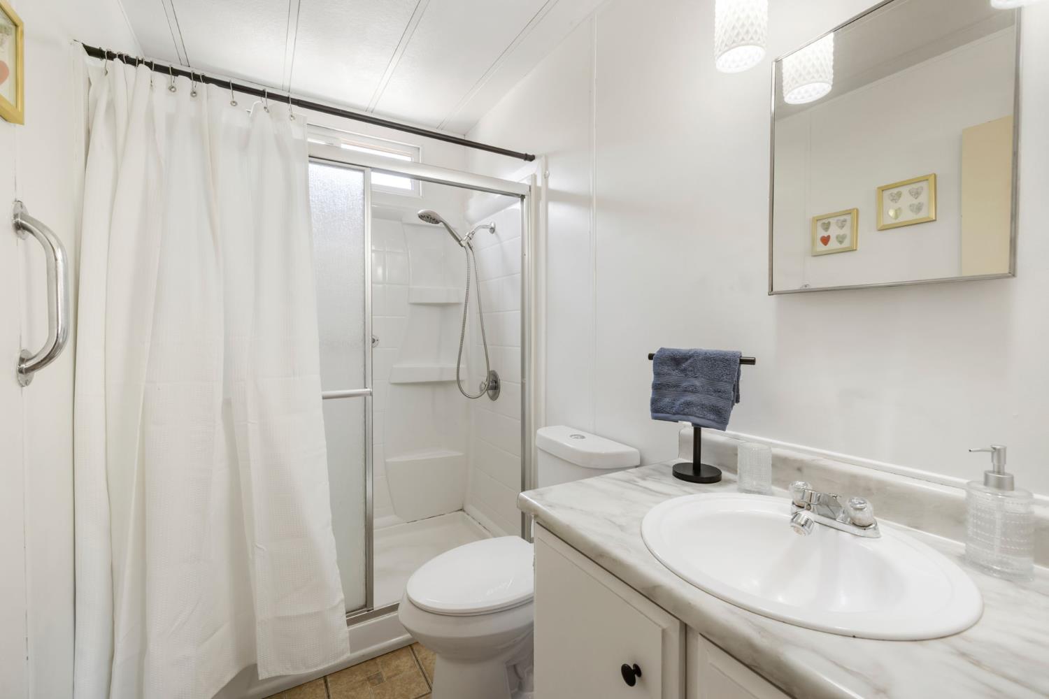 4700 Old French Town Road, Unit 64 Shingle Springs, CA 95682 - Photo 18 of 26 a bathroom with a sink toilet and shower